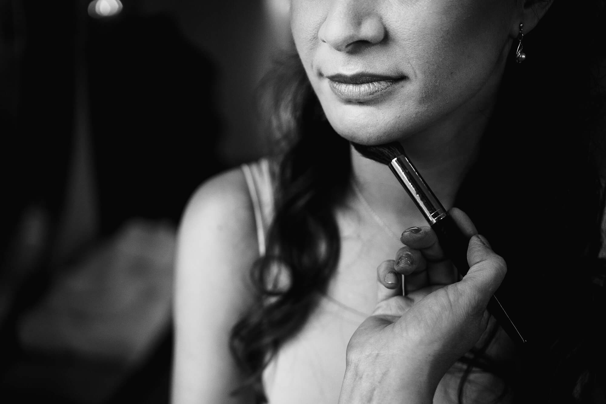 finishing touches for bride at wedding