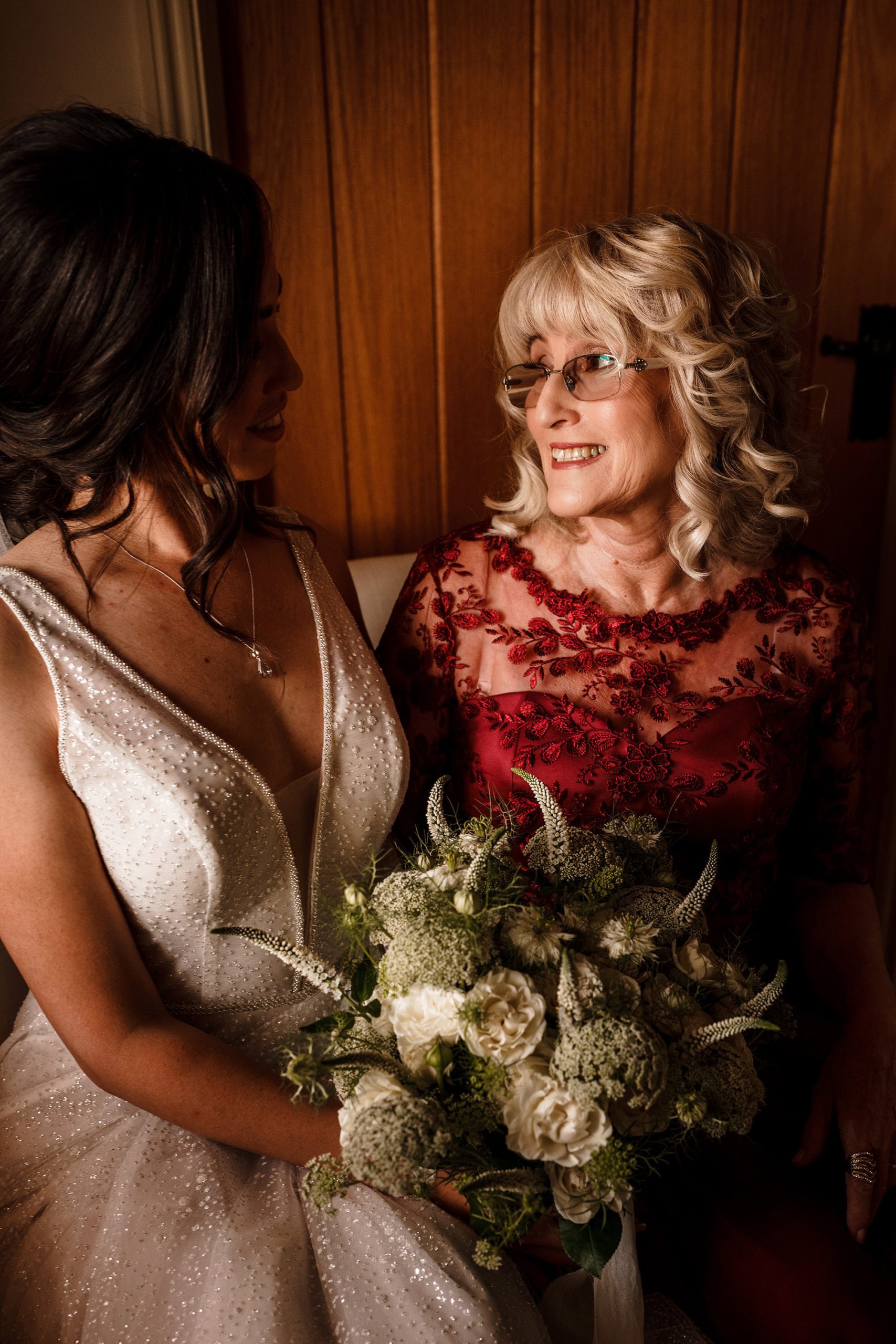 mother and daughter enjoying moment before wedding