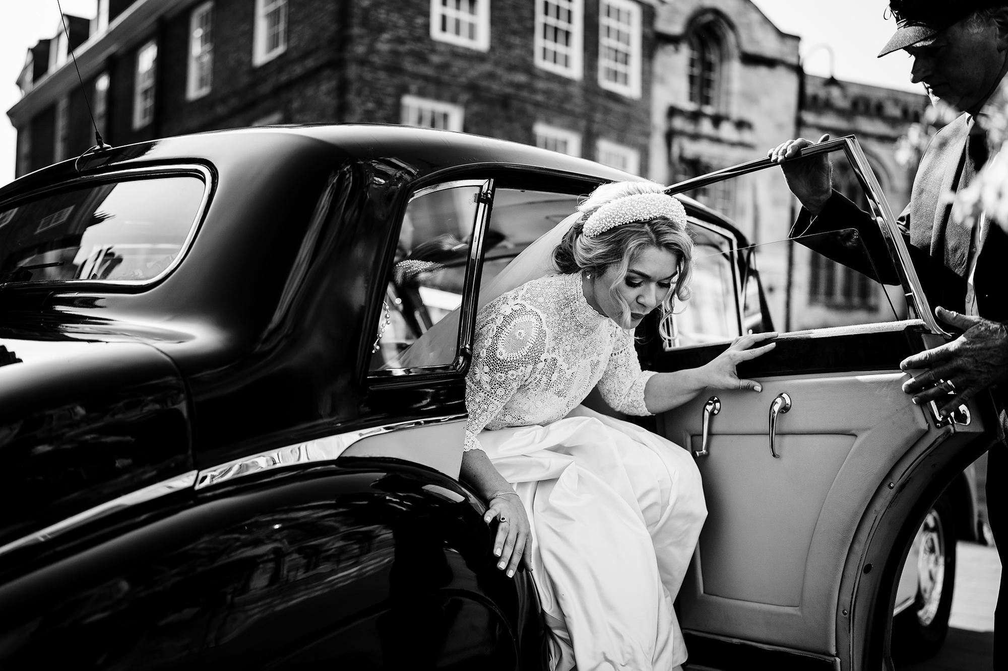 bride getting out of her car for her cotswolds wedding ceremony