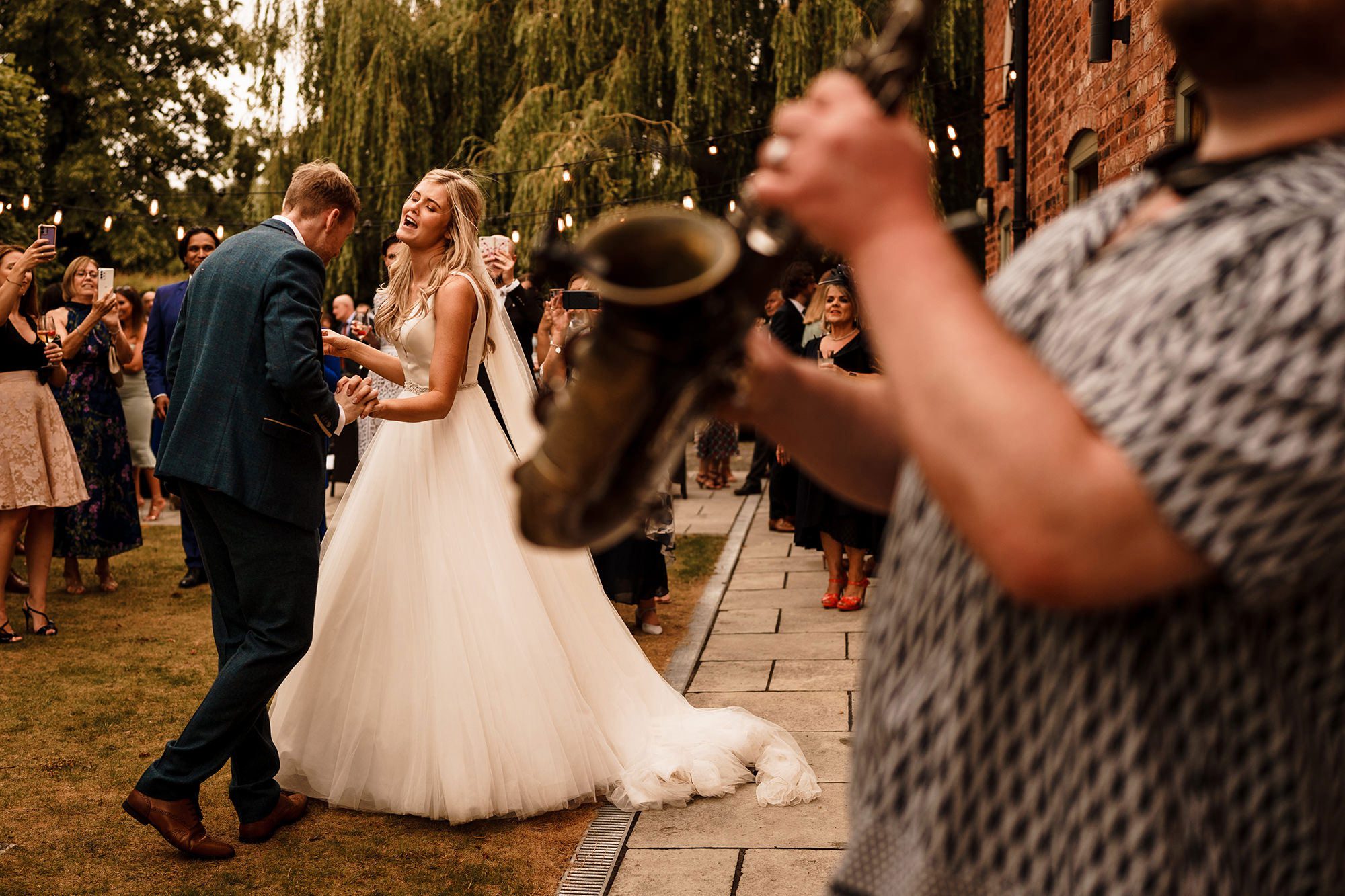 bride and groom dancing to music in outdoor Lake District wedding venue