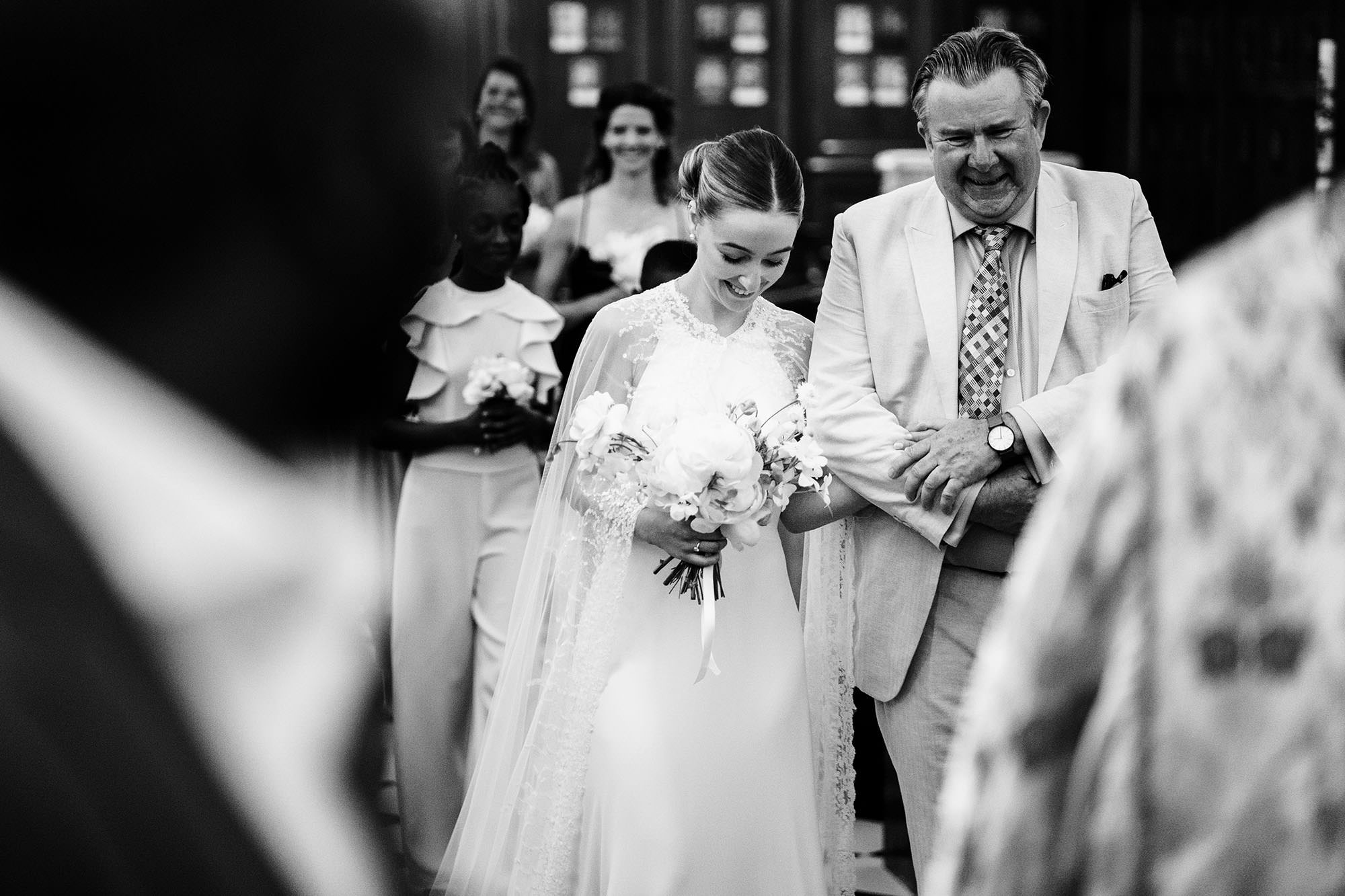 bride walks down London chapel with father