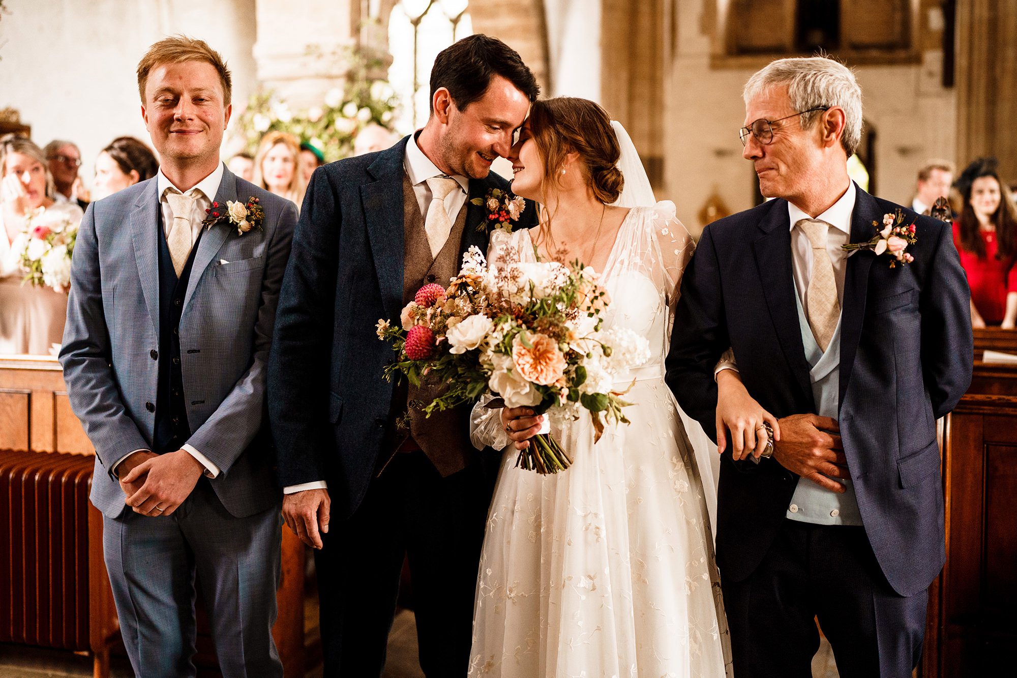 bride and groom touch heads at London church ceremony