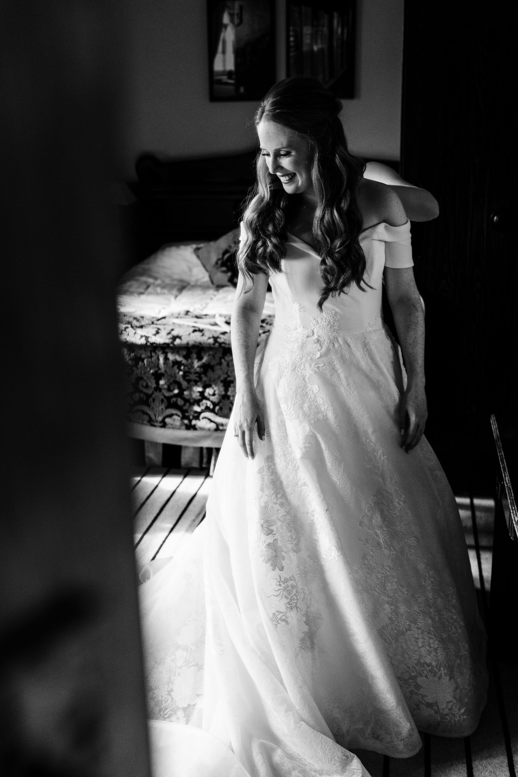bride standing in nice light on the morning of her wedding
