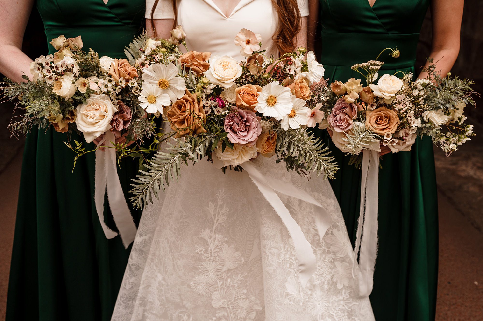 the brides and her bridesmaids flowers bunches together