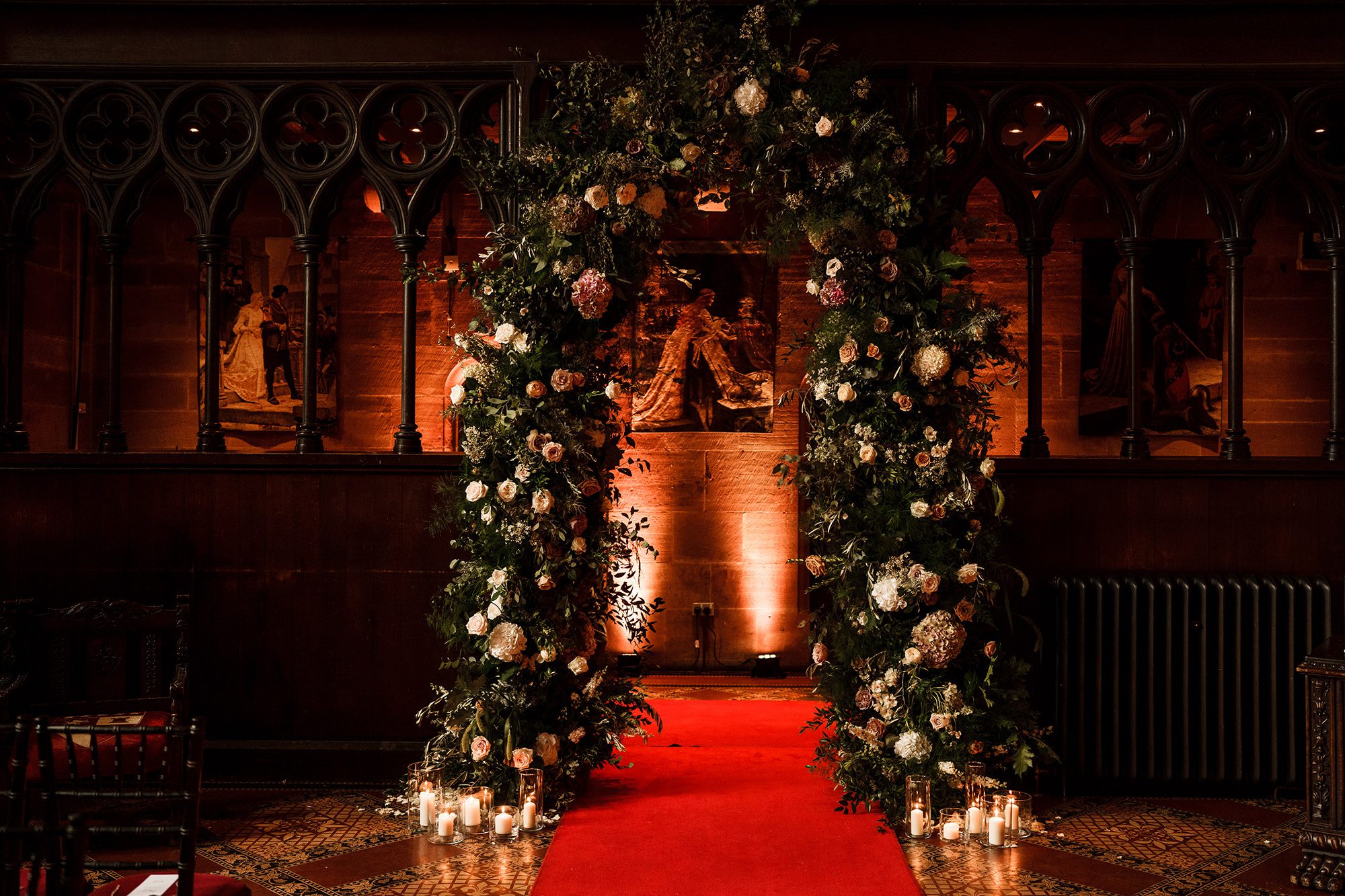 an archway of flowers at Peckforton Castle