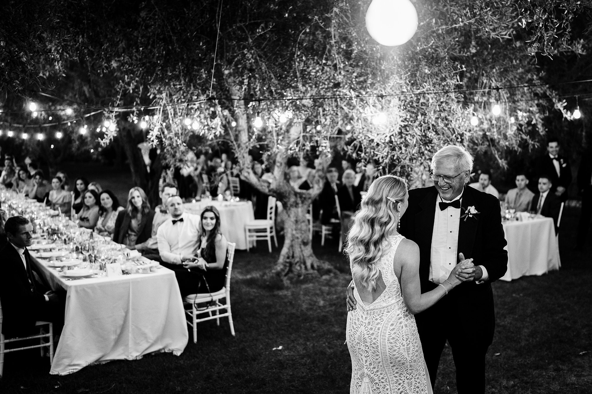 bride and her father dancing at Italian wedding in black and white