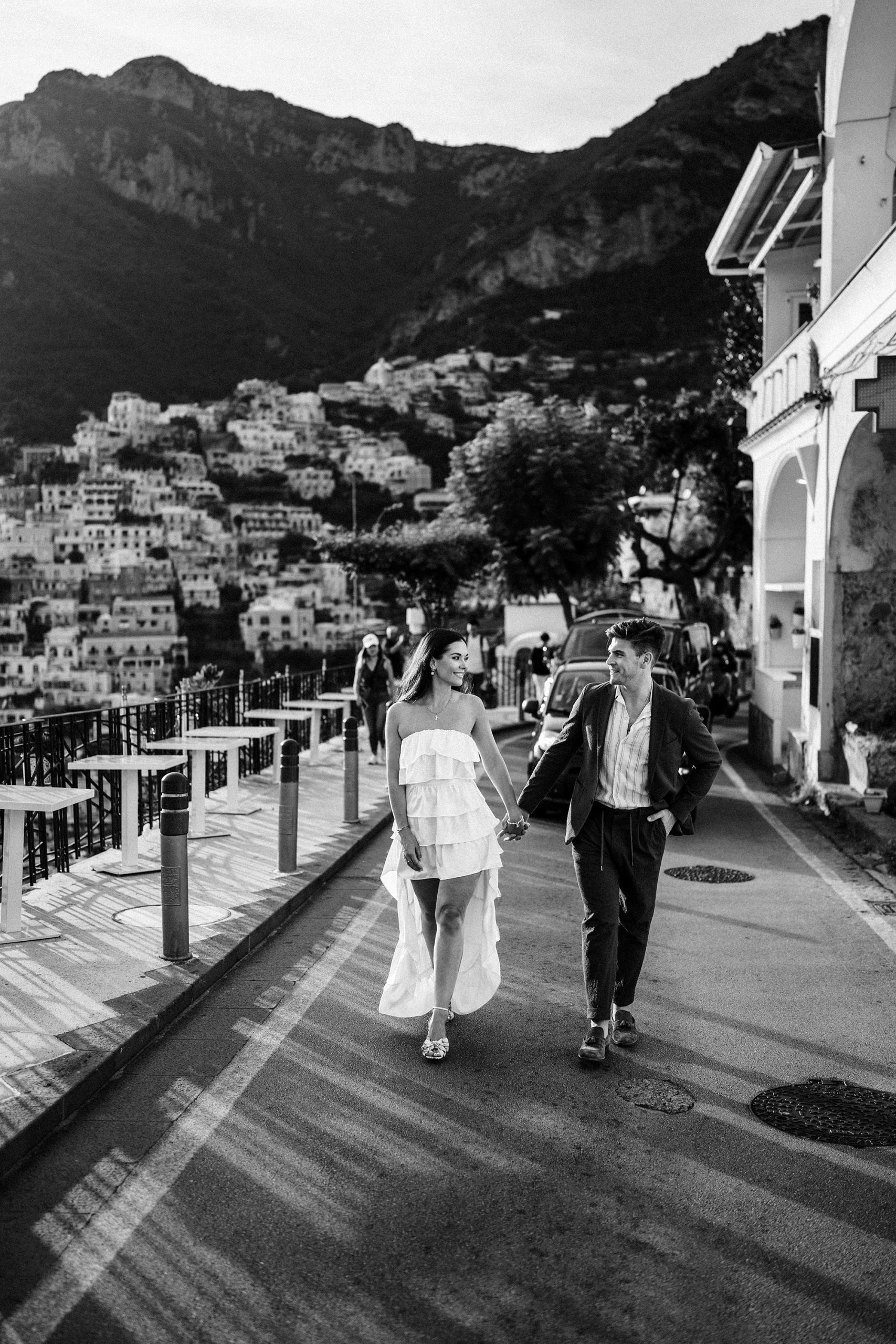 couple walking though italy as intructed by their elopement photographer