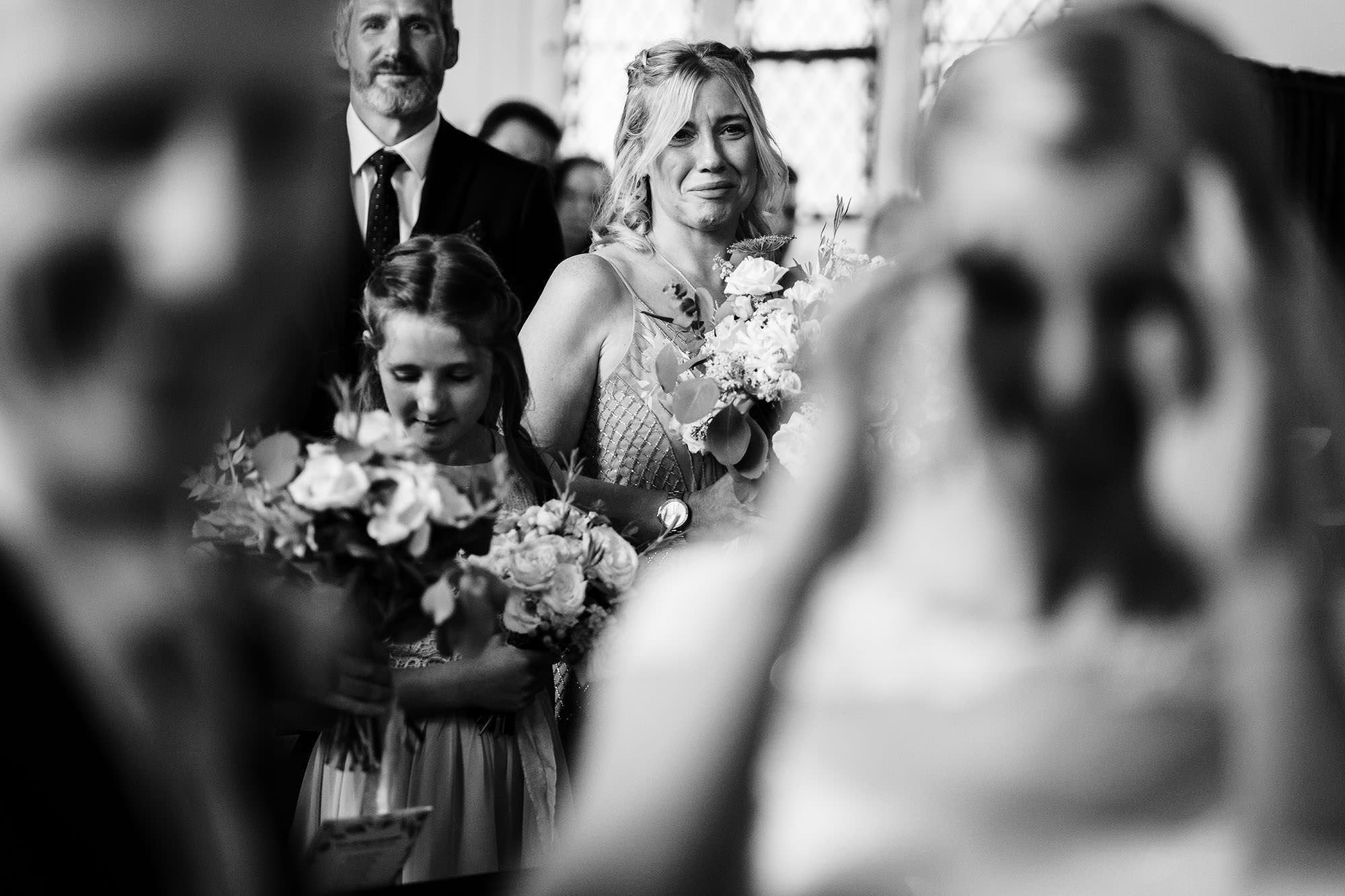 bridesmaid crying during church wedding service