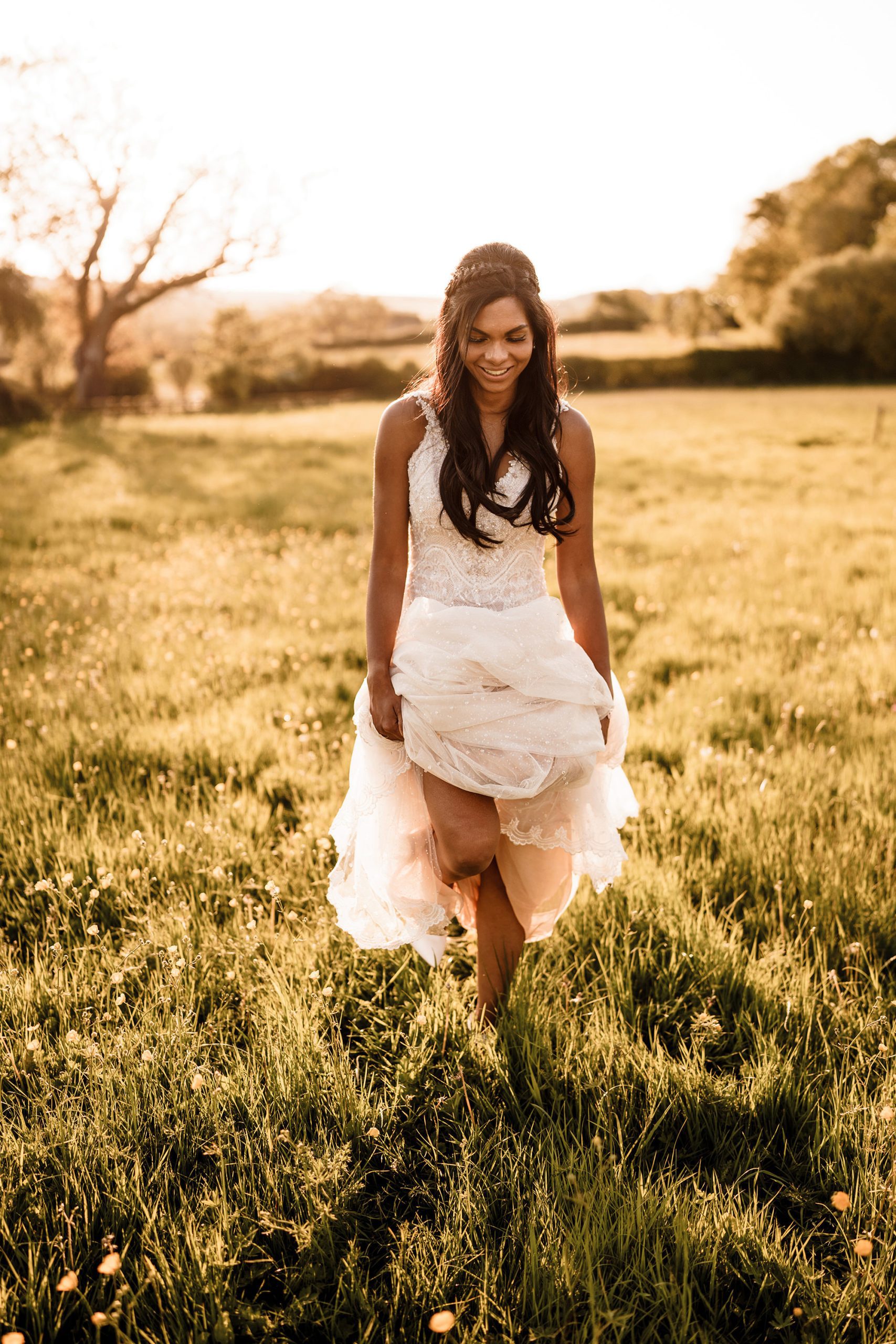bride walking through the grass at Hyde house wedding