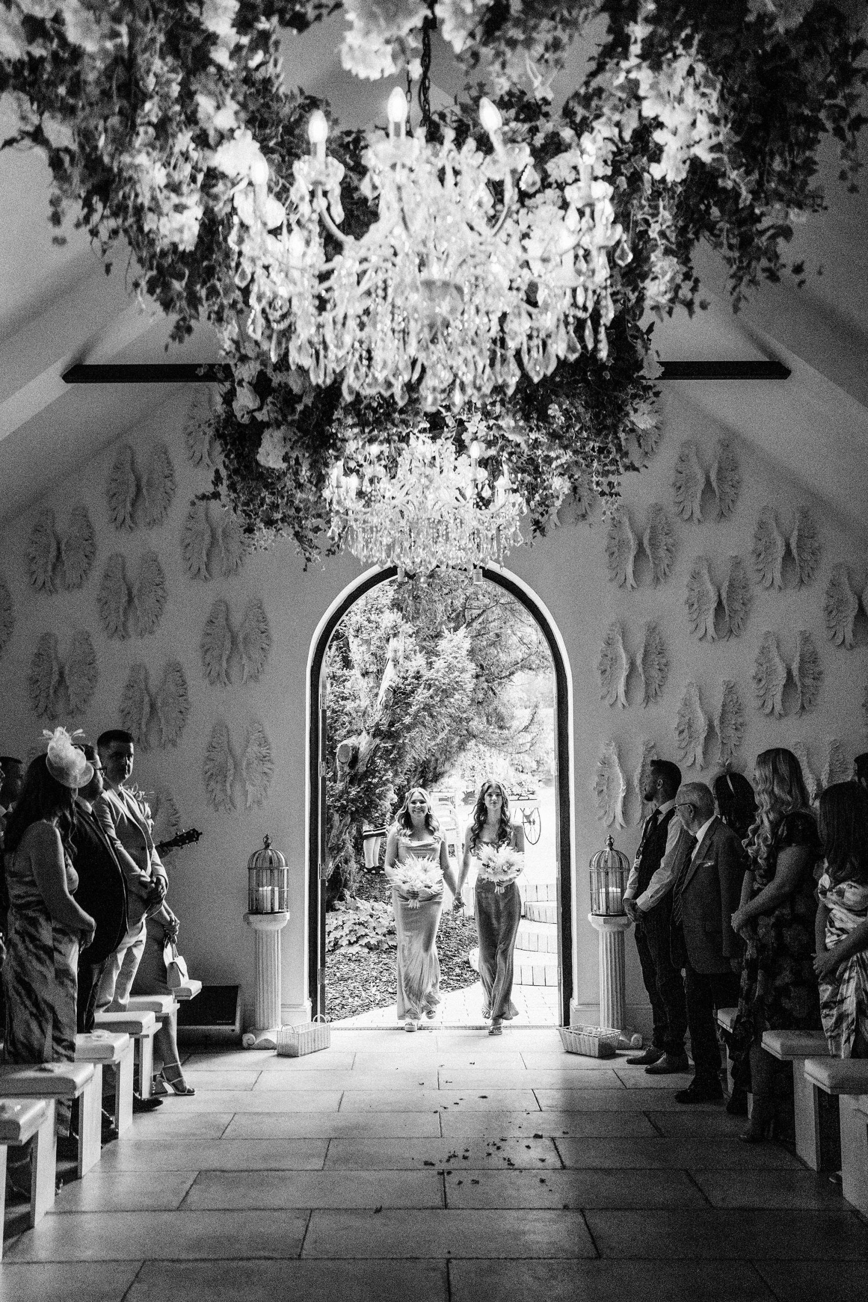 bridesmaids walking into wedding ceremony at Woodhill hall olive room