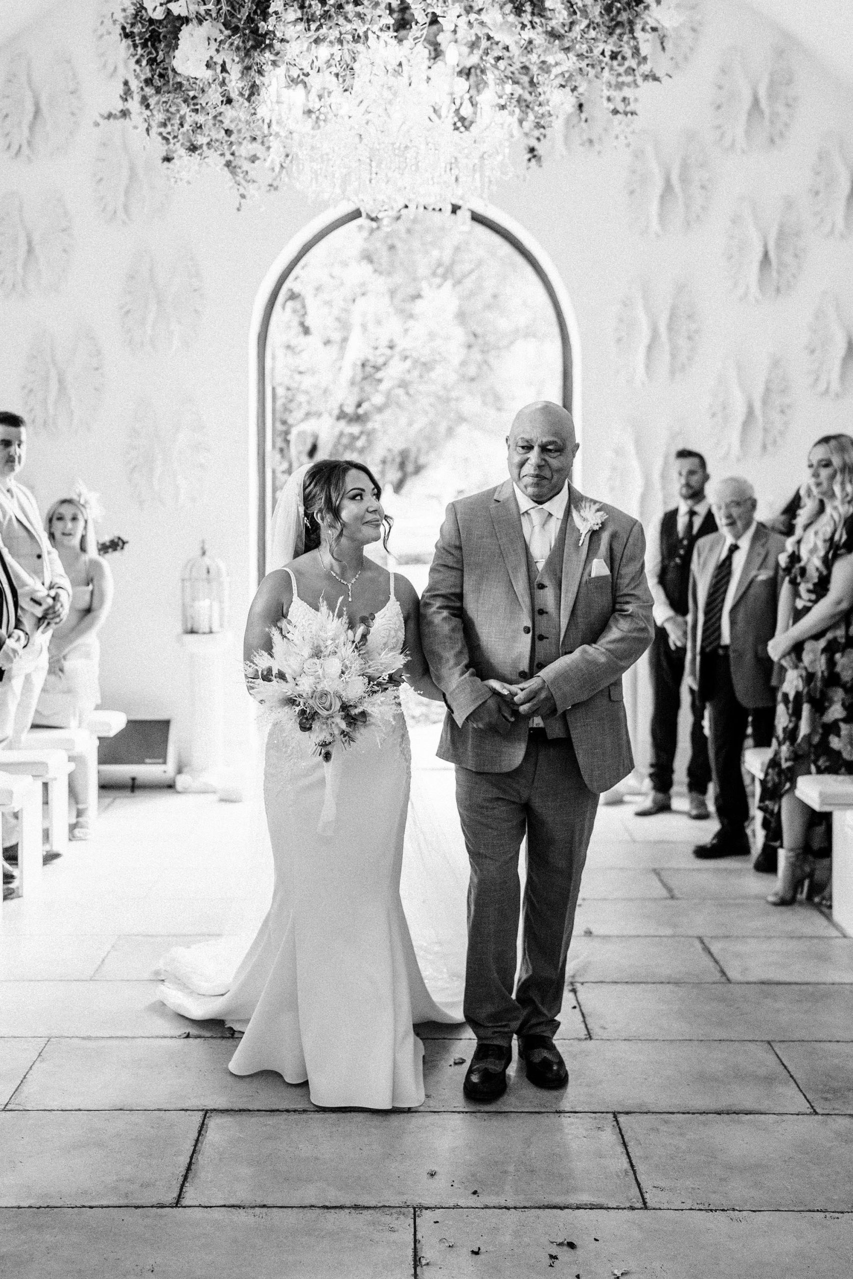 bride and her father walking down the isle at woodhill hall