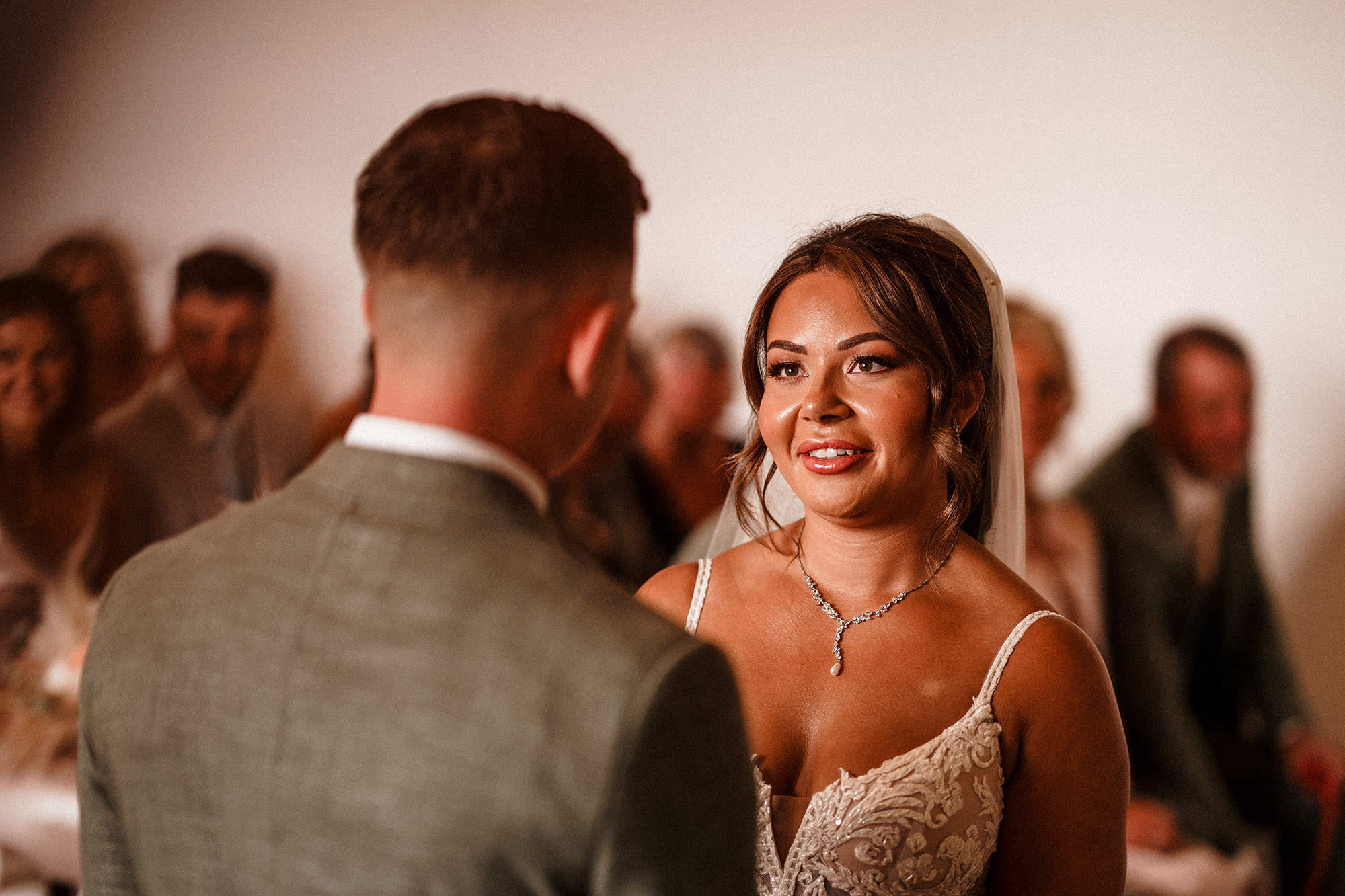 bride looking at her groom during wedding ceremony at woodhill hall