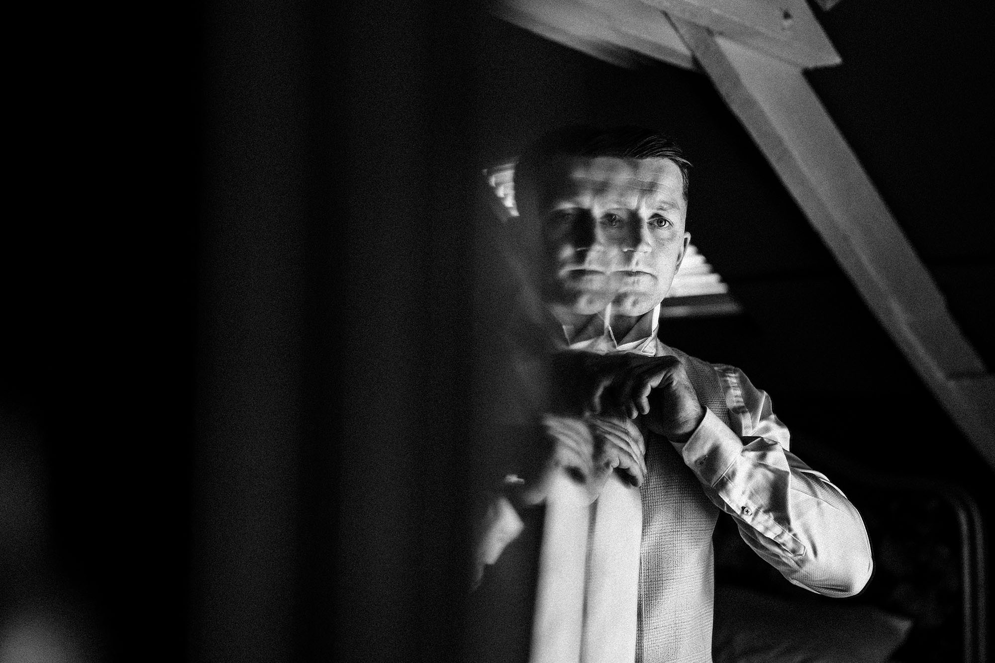 Groom getting dressed at Woodhill hall