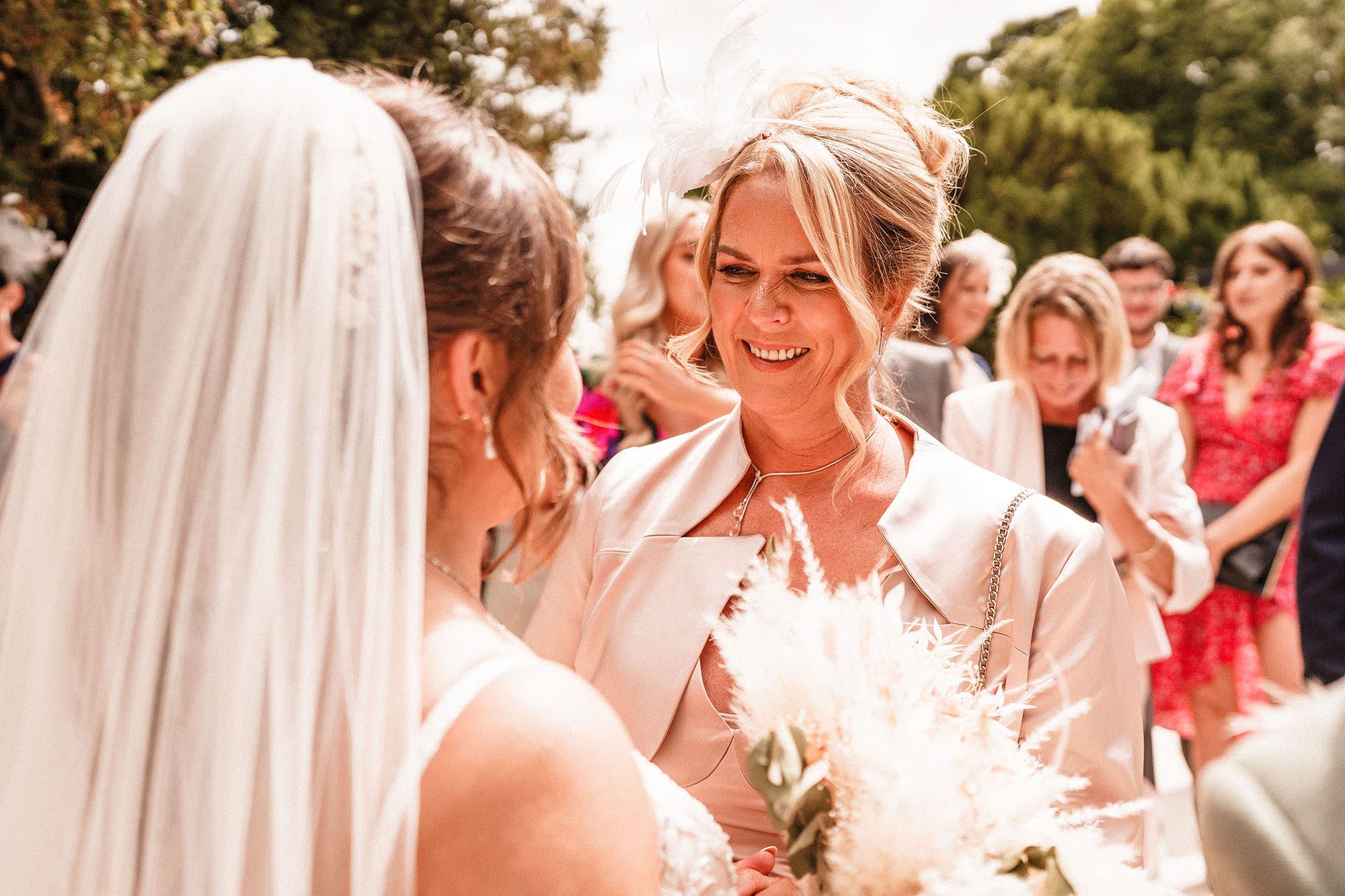 mother of the groom looking at bride at woodhill hall
