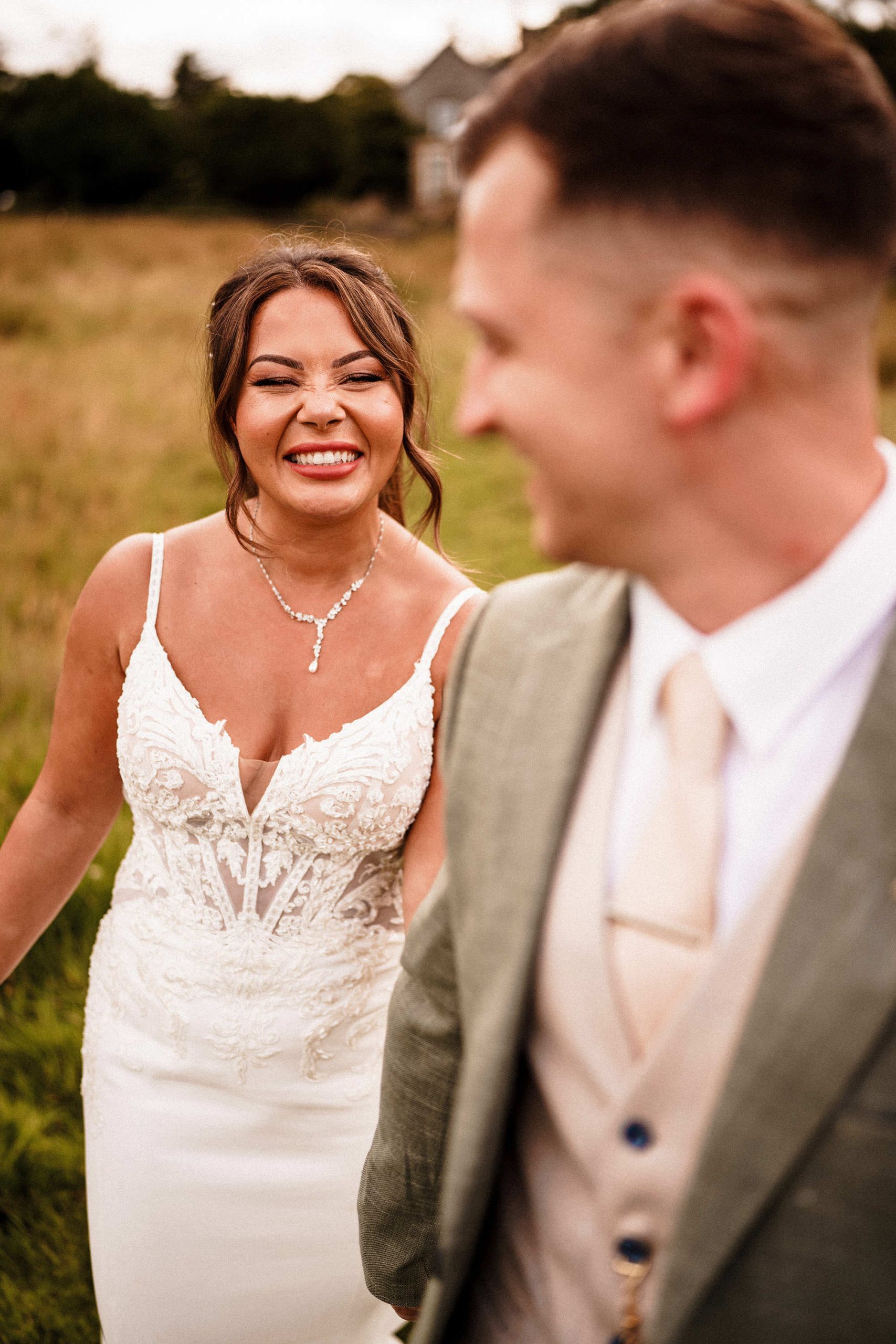 bride smiling at her groom on her wedding