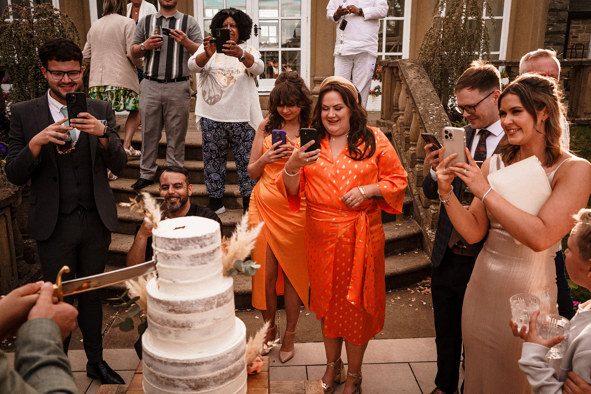 guest take photos of cake