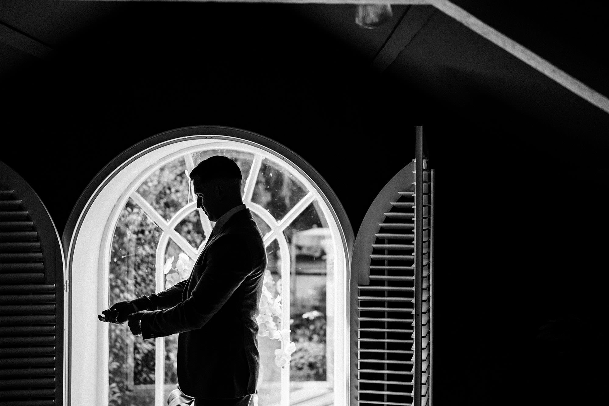 groom poses for Woodhill Hall Wedding Photo