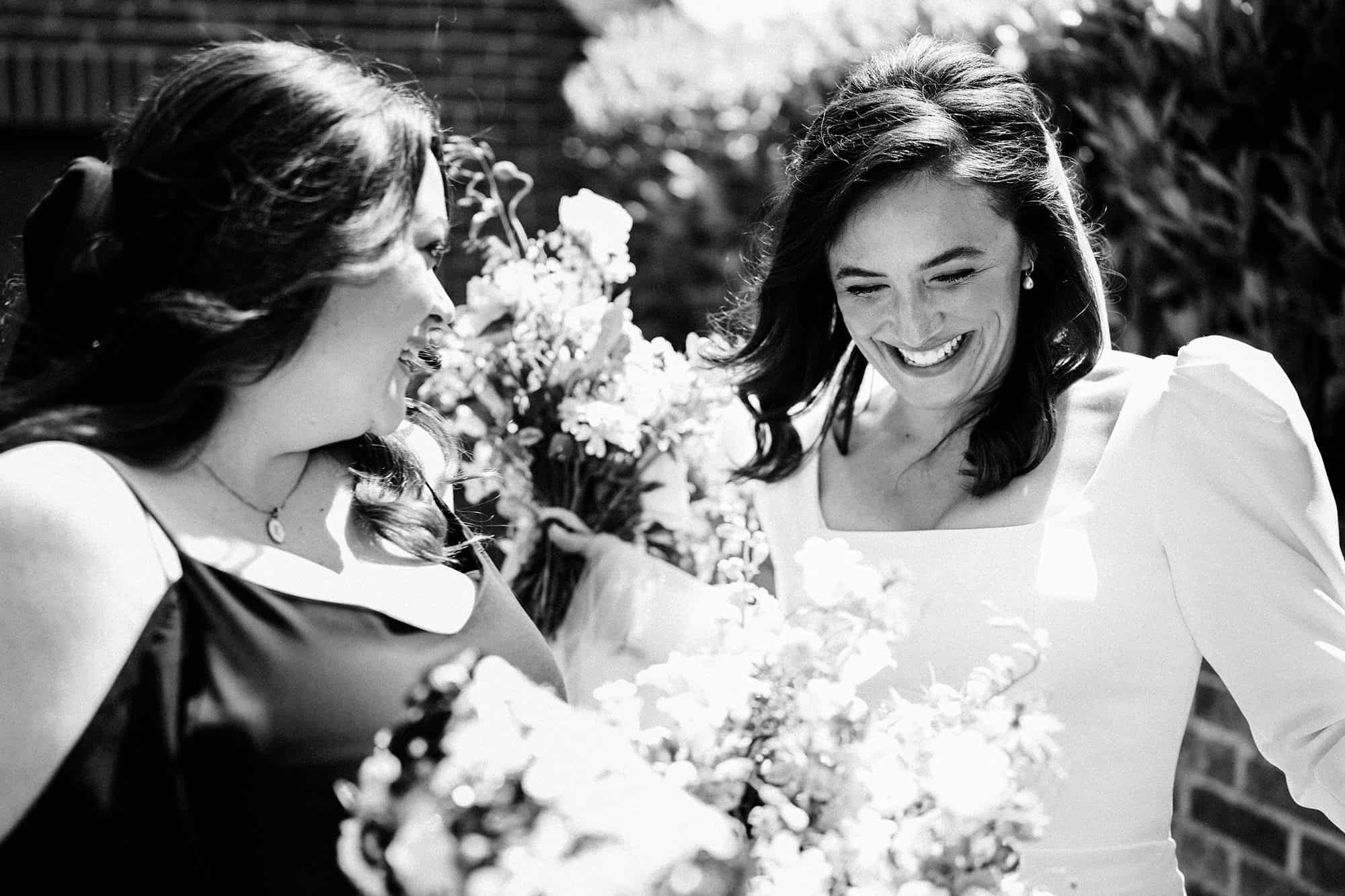 bride with her bridesmainds on wedding day