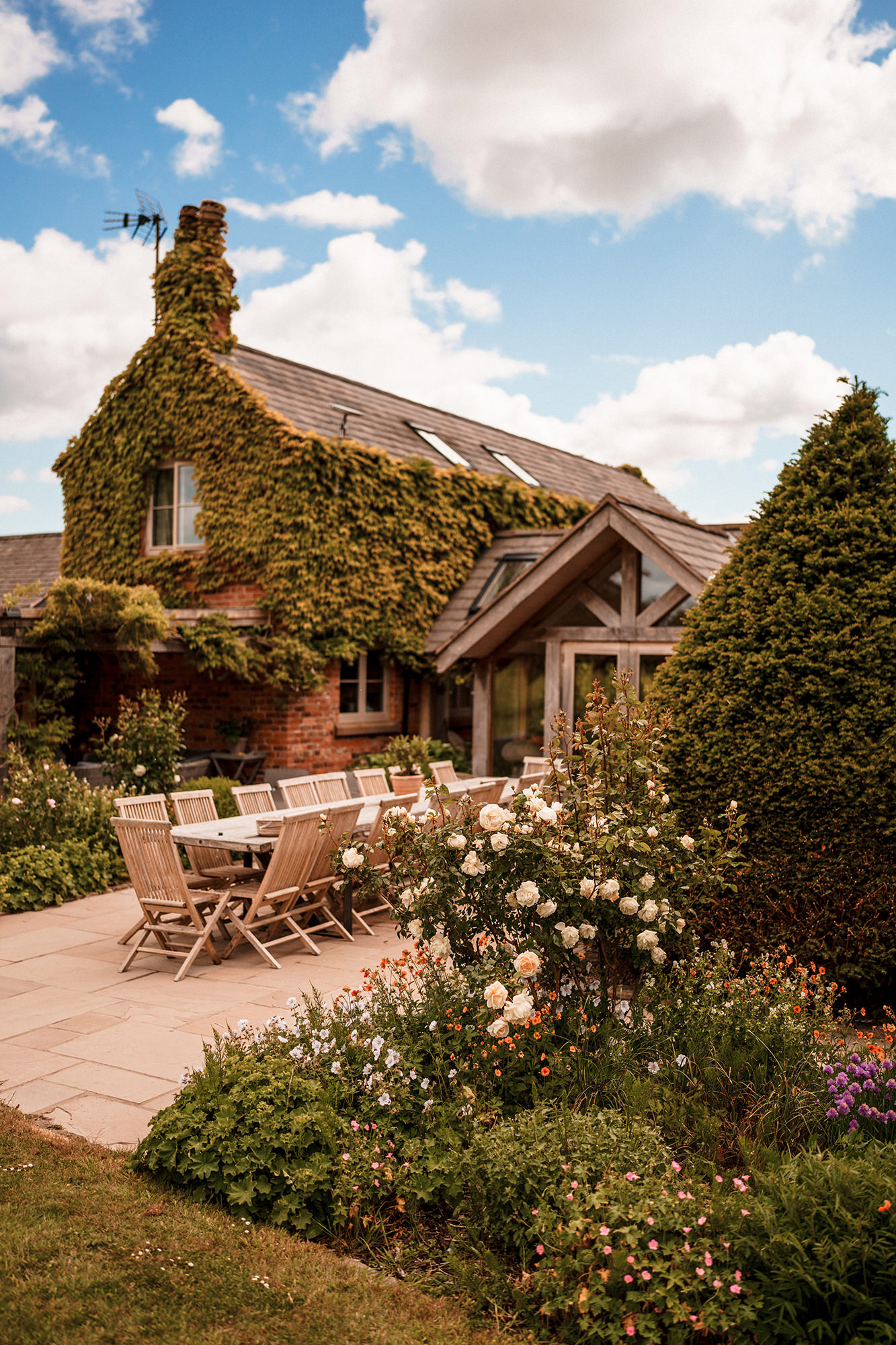 Garden patio and ivy covered exterior at Scarlett Hall wedding venue in Cheshire