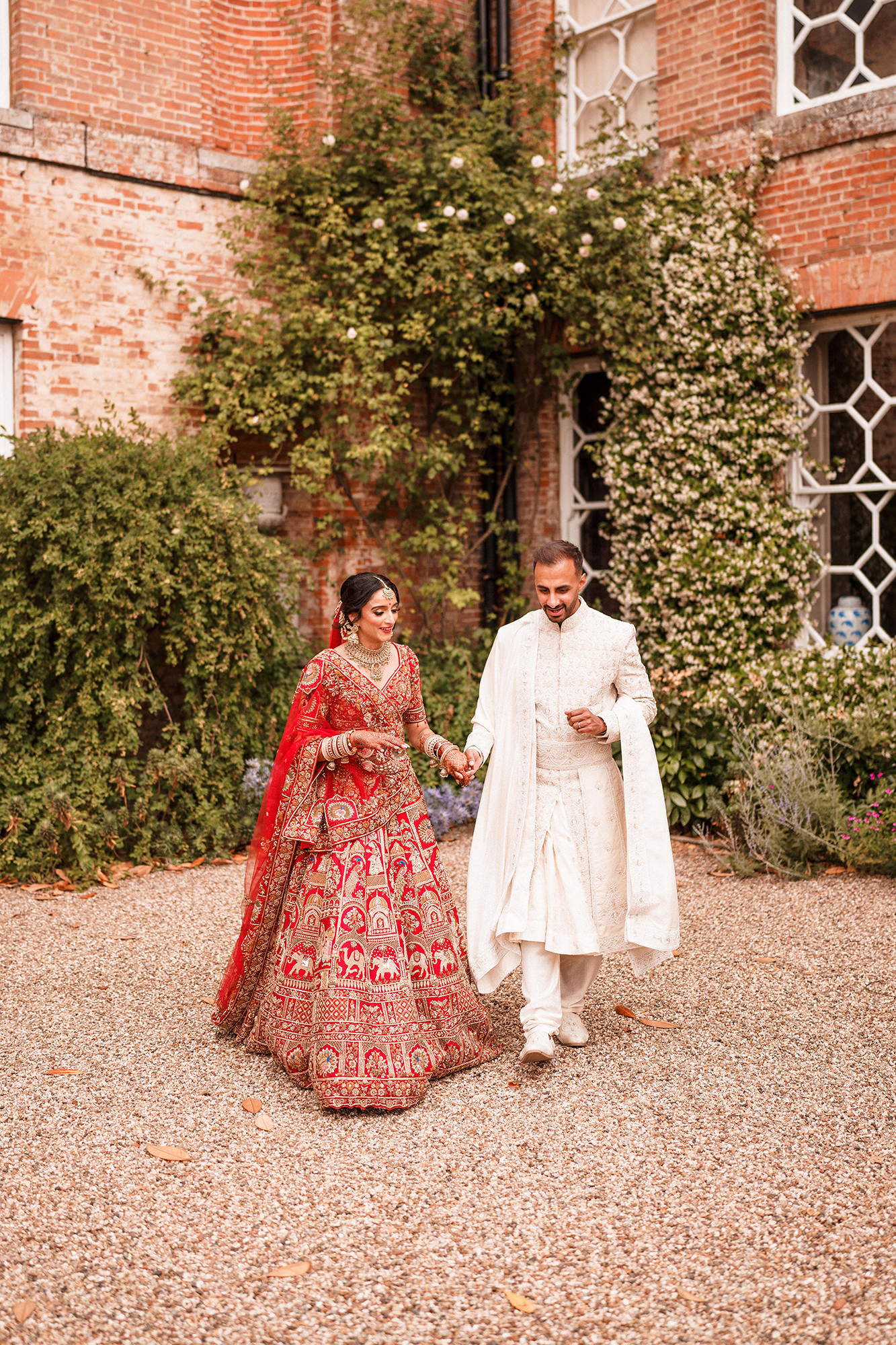 Guests enjoying drinks reception at Braxted Park wedding venue