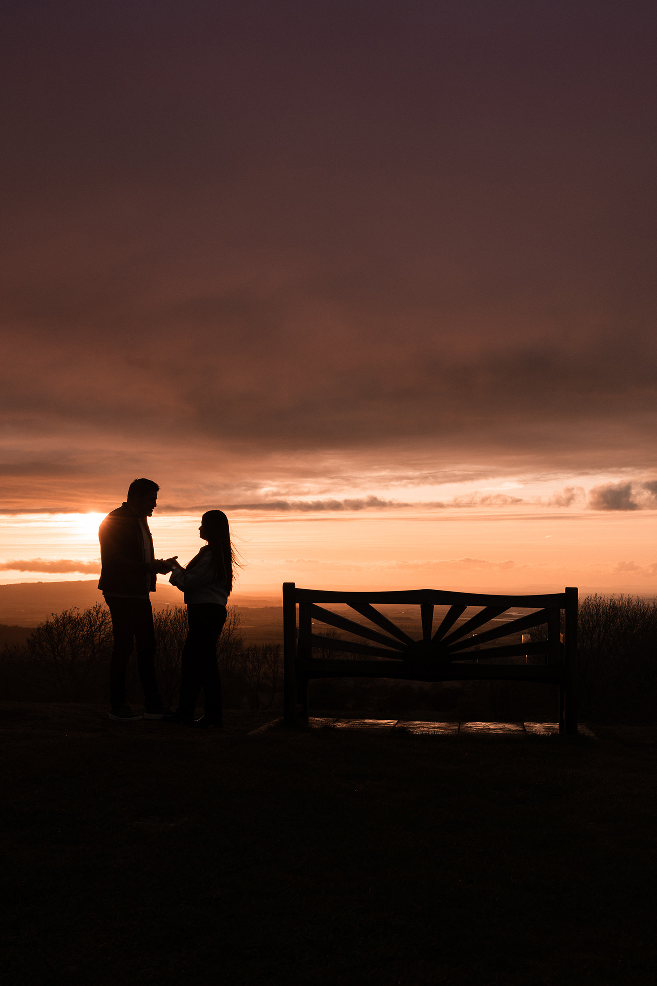 Alfredo and Jennifer sitting together after their Broadway Tower proposal