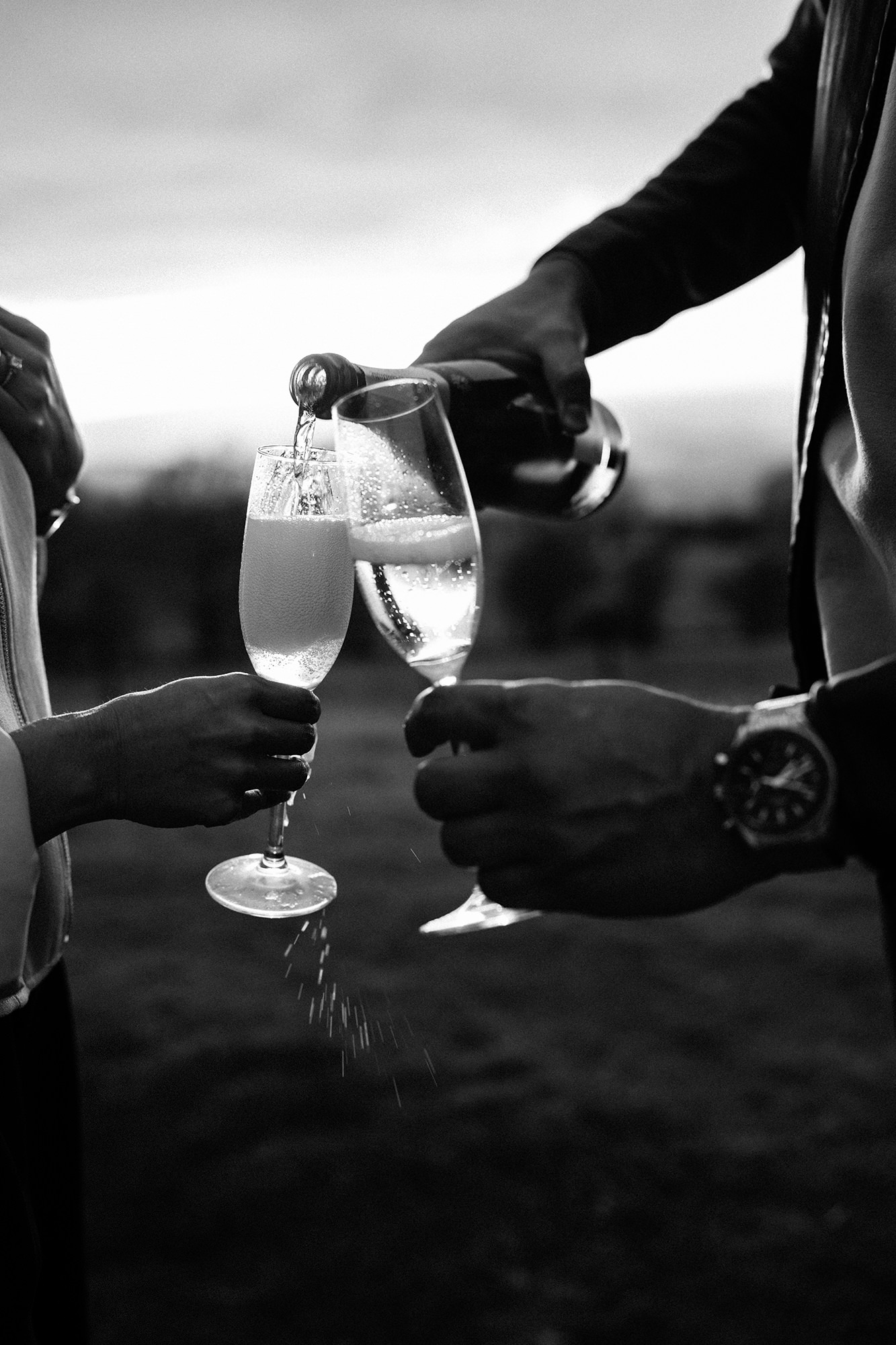 Newly engaged couple celebrating at Broadway Tower in the Cotswolds