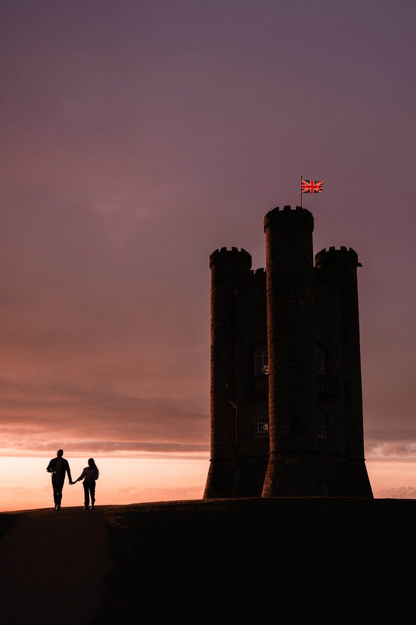 Backlit proposal photo at Broadway Tower during sunset