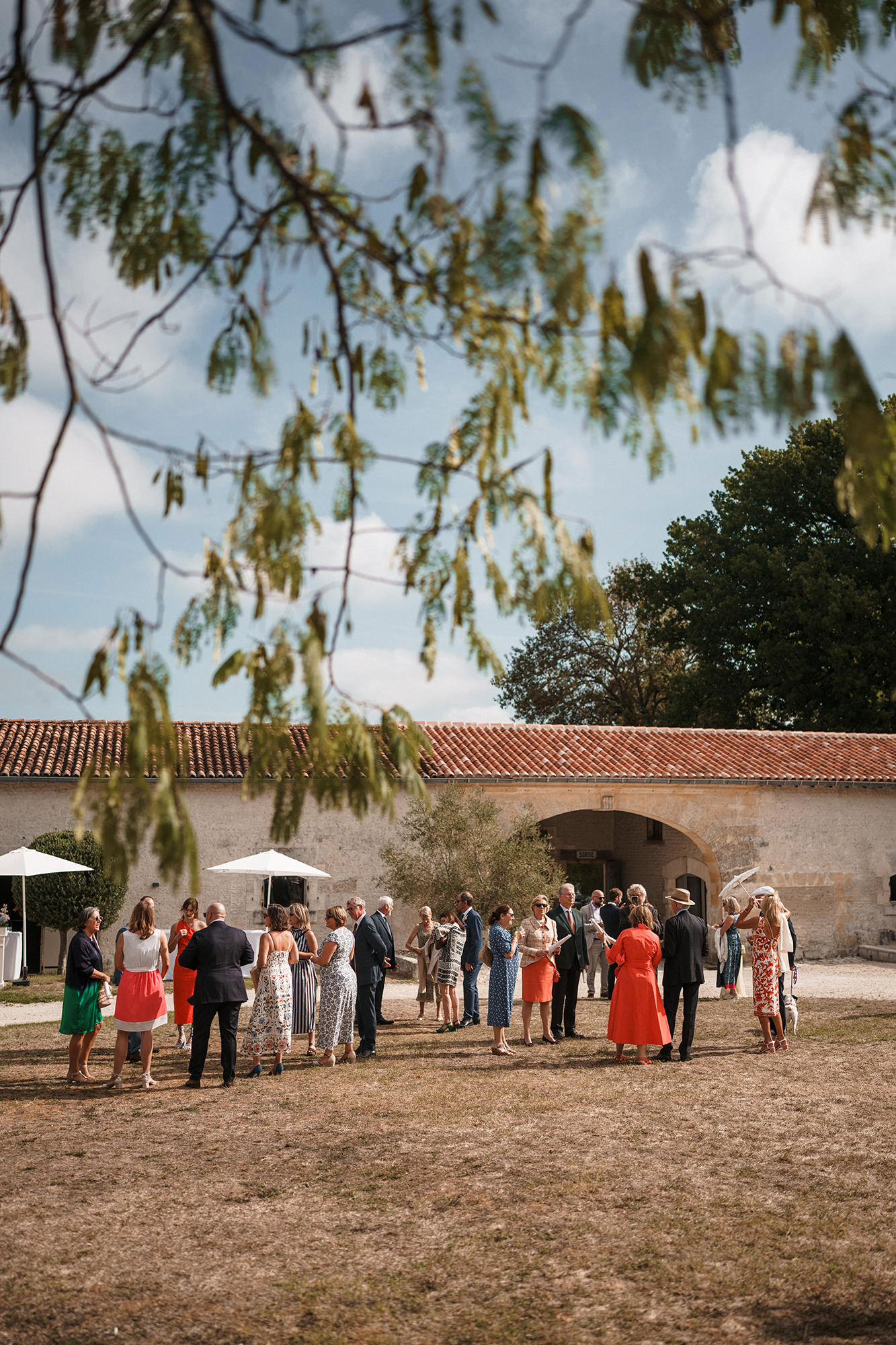 Wedding guests gathering together at La Cannonerie in France