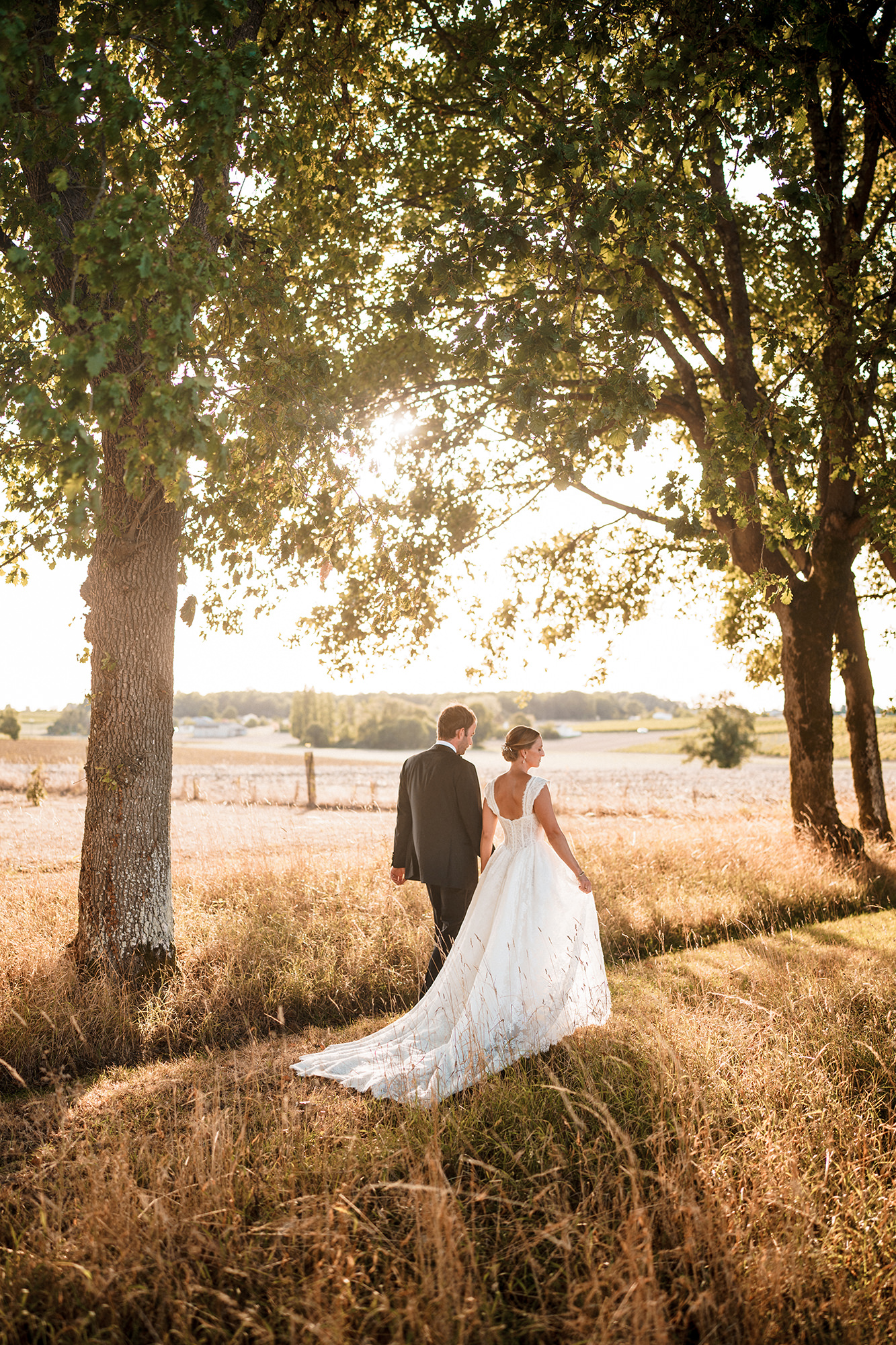 Anne-Sophie and Clément walking through the countryside at La Cannonerie