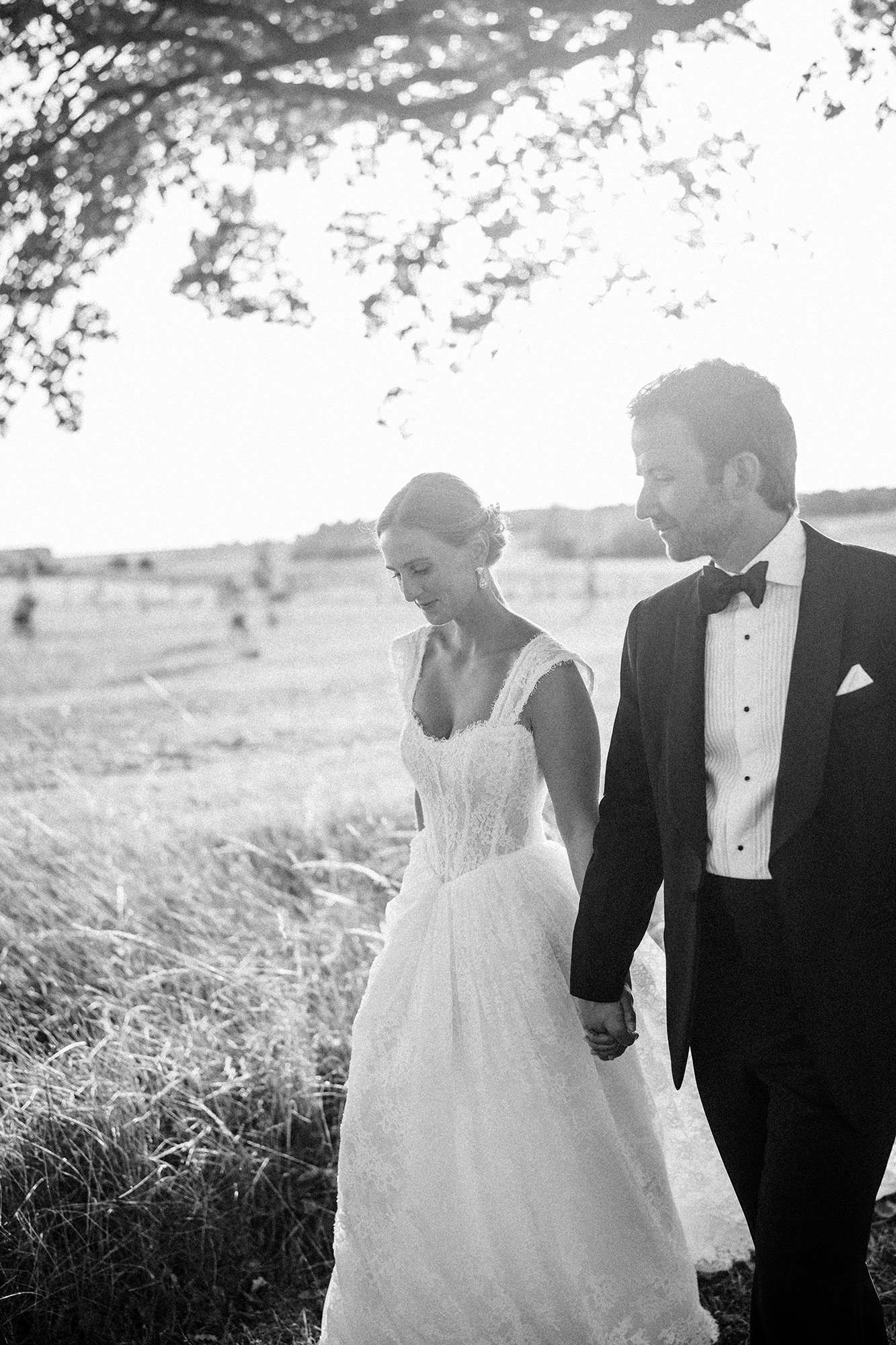 Anne-Sophie and Clément walking hand in hand at La Cannonerie
