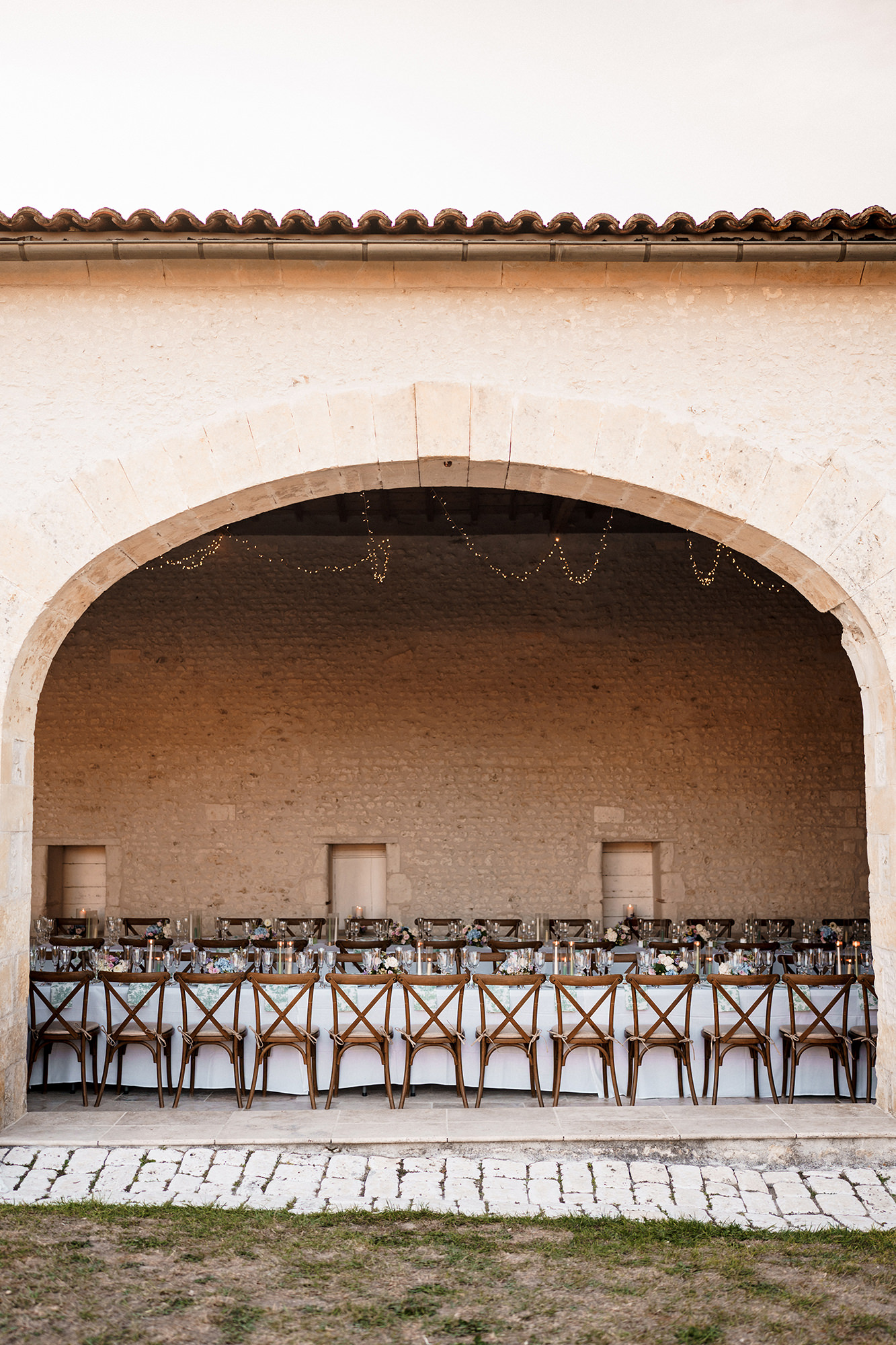 Wedding breakfast beneath the stone arches at La Cannonerie