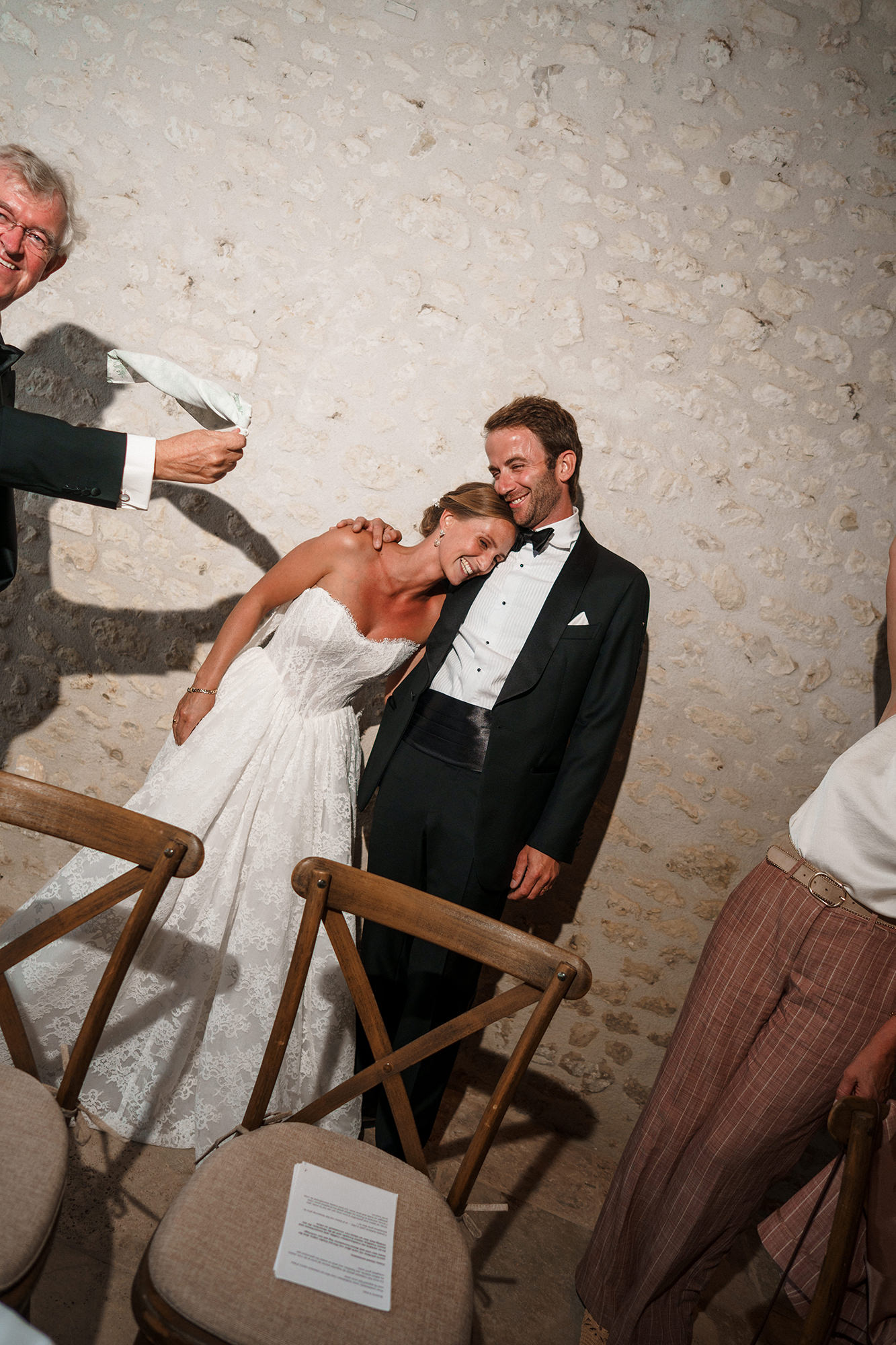Anne-Sophie and Clément laughing during their evening wedding reception