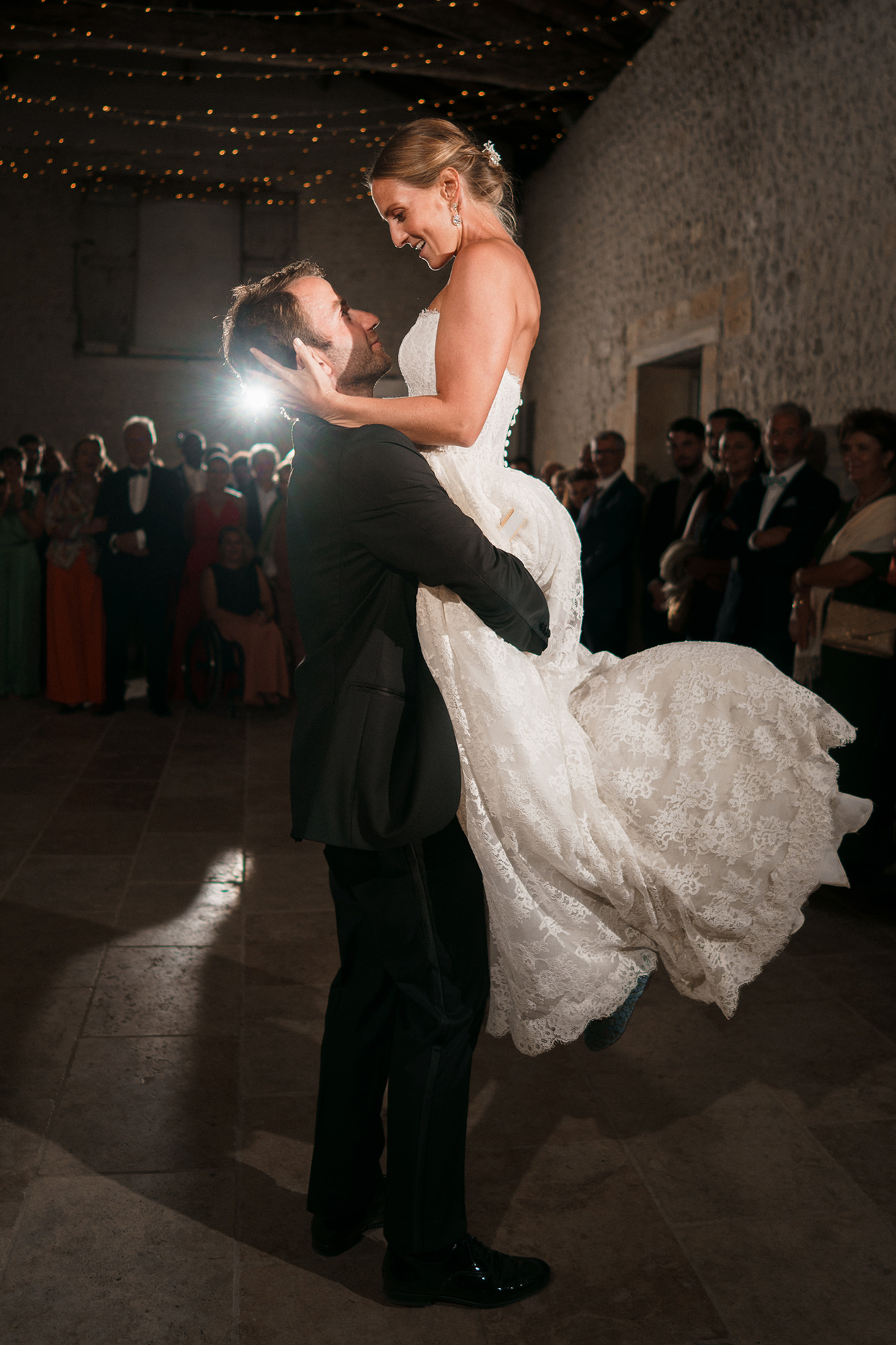 Anne-Sophie and Clément celebrating on the dance floor at La Cannonerie