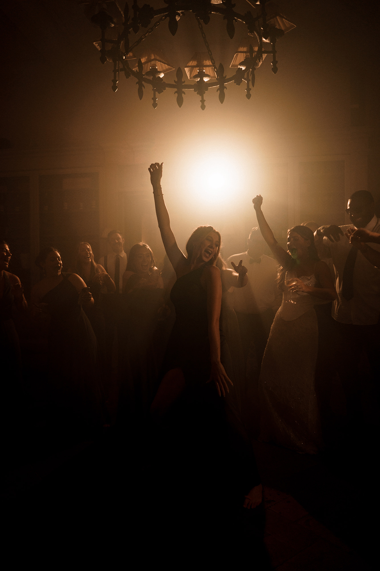 Wedding guests dancing beneath warm evening light in France