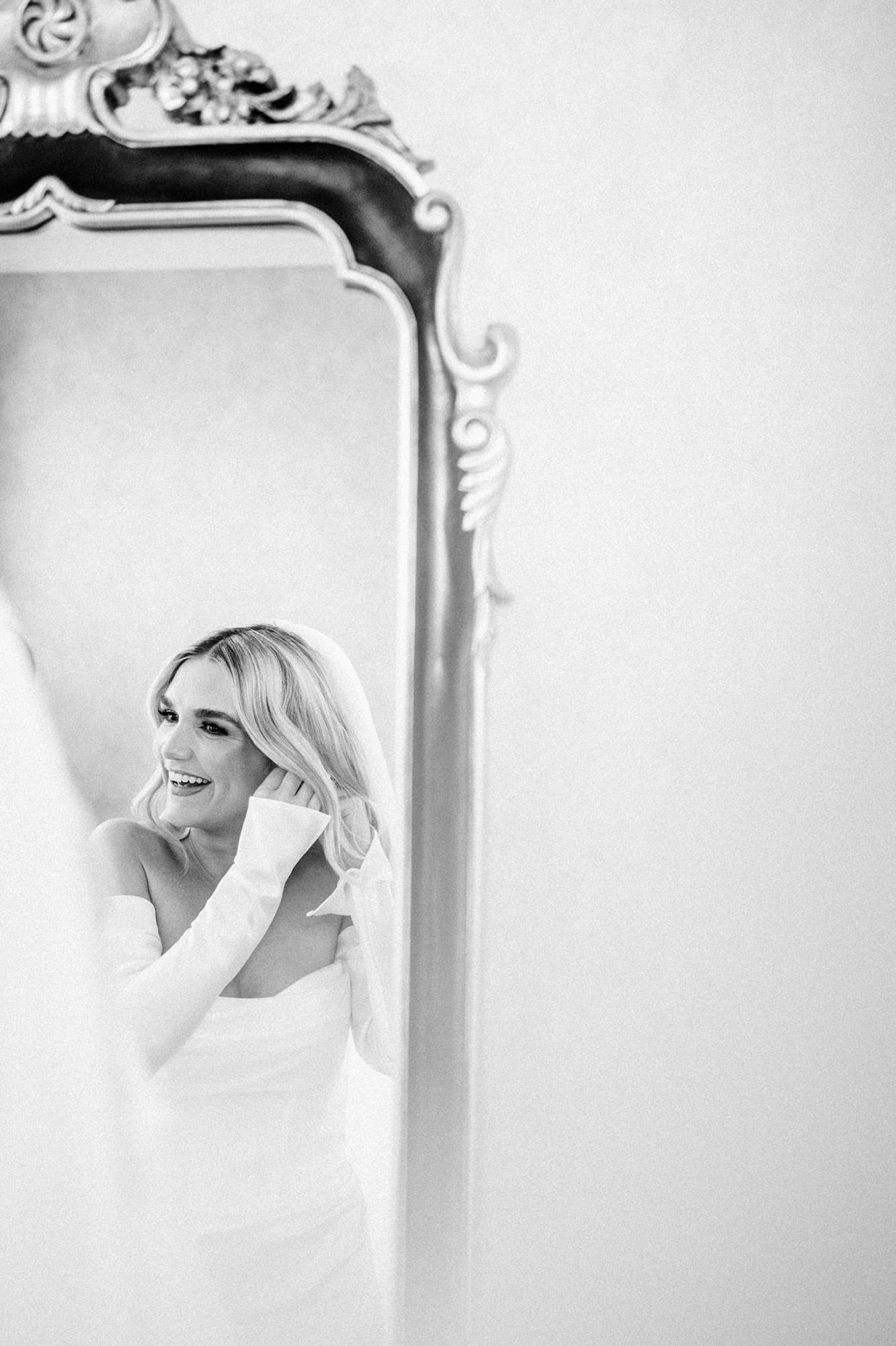 Black and white bridal portrait reflected in a mirror